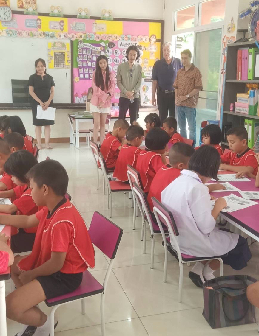 Observing classroom activities during the school visit.