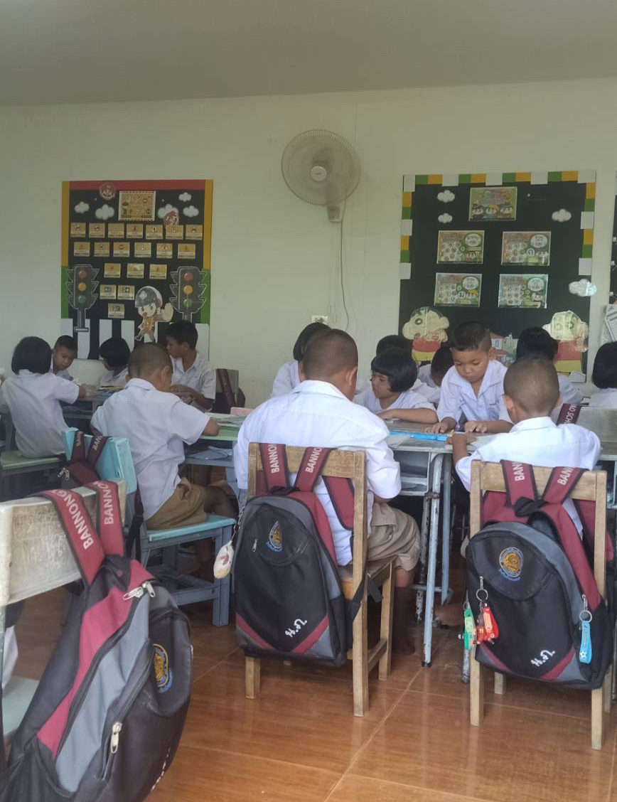 Children working on classroom exercises at Ban Nong Taphao School.